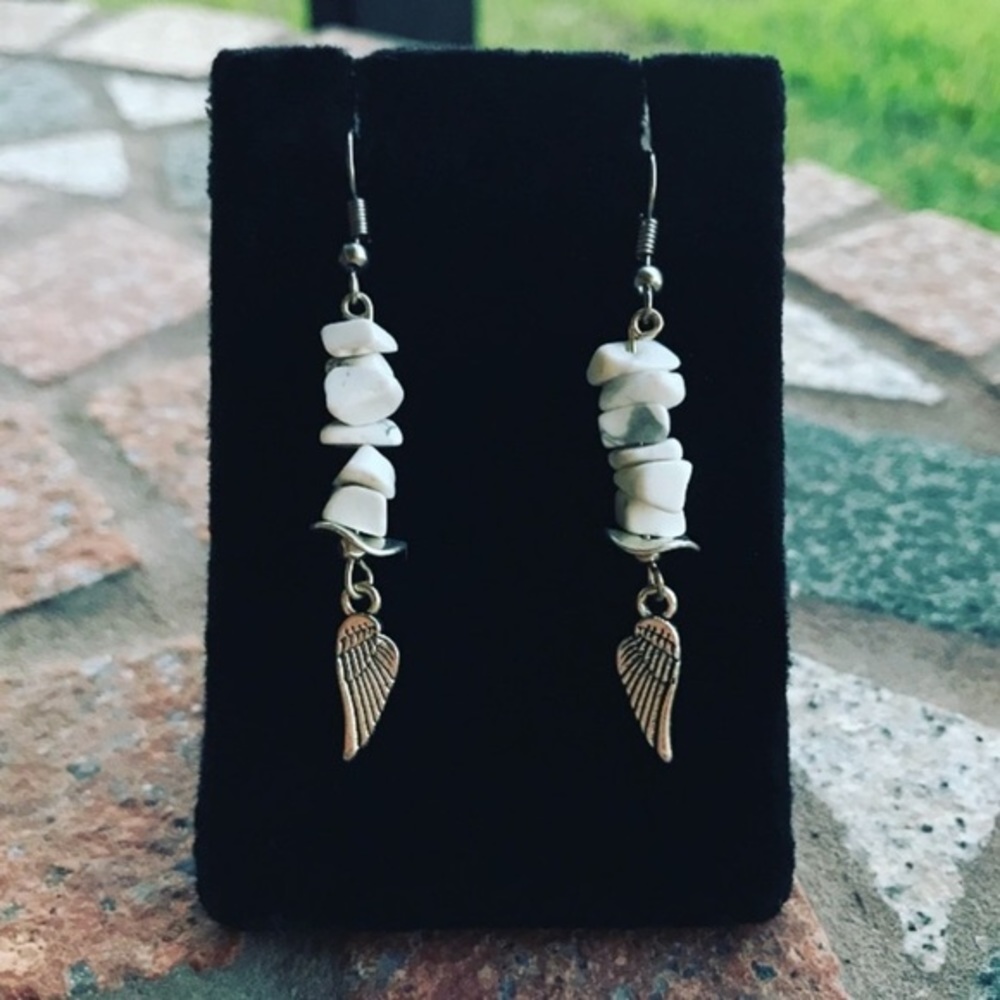Genuine howlite angel wing dangly steel earrings